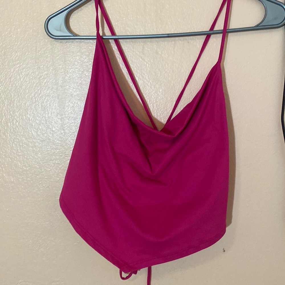 Hot pink top size medium.Soft material. Bought it from tj max